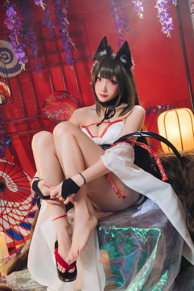 瓜希酱COS英雄联盟阿狸:暖光下的九尾狐娘妩媚演绎